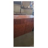 Wooden 10 drawer dresser with some damage