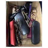 Mix of sunglasses and glasses with cases