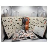 Six Halloween bags, two black and orange tissues,