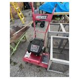 Huskee front-tine gear-drive rototiller powered