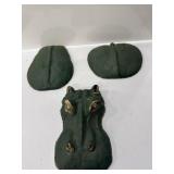 green-painted concrete hippopotamus yard art