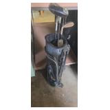 Small Nike golf bag with Nike clubs