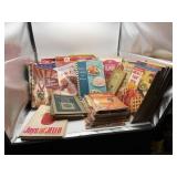 A large variety of paperback pamphlet cookbooks