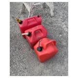 Three various size gas cans
