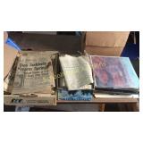 Group of old newspapers and records