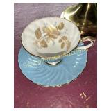 Cup and saucer with gold rim