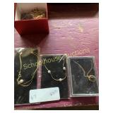 Necklaces in wrappers and box