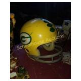 One large green bay helmet and small radio GB