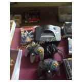 Nintendo 64 with 2 controllers and 1 toy story 2