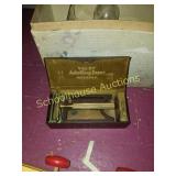 Small razor with metal case.