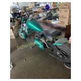 Green home made mini bike with pull start motor