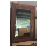Wood framed old mirror