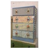 Cute 4 drawer wood dresser. Top drawer sticks