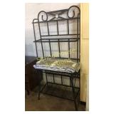 Bakers rack. Glass shelves are wrapped in the