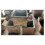 three concrete planters