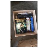 box of assorted dvds