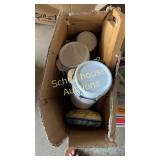 box of white canisters with lids and cutting