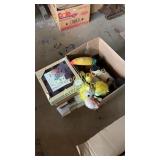 ceramic trivets and box of stuffed animals