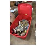 red tote of miscellaneous decorations & towel