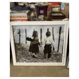 Picture boy and girl in frame ready for hanging