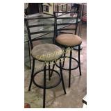 2 metal stools. 1 gray 1 brown