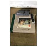 Curtis DVD player, Polaroid remote, glass frame