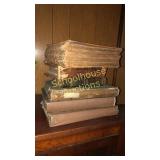 Stack of antique bibles. Oldest is 1864. Newest
