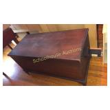 Large old cedar chest on casters. Lined with