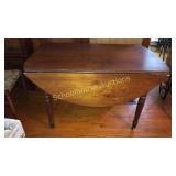 Drop leaf dining table on casters, oval when
