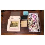 Old pics, stack of foil prints, & reading glasses