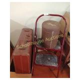 Short ladder with can and suitcase