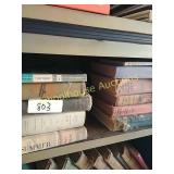 Single shelf of vintage books (11 total)