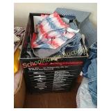 Medium box of fabric pieces and some denim jeans