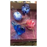 4 paperweights. 3 Joe St Clair, solid blue is not