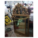 Large ornate mirror with gold trim. Measurements