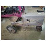 Old barn fresh pedal tractor. I believe