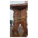 Small carved table. Approx 15 inches tall and 12