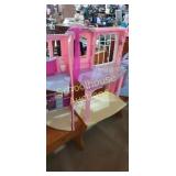 Plastic dollhouse.  About 3 ft wide when fully