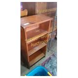 Media storage shelf.  Approx 4 ft tall 12 inches