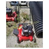 Shiny red yard machine mower