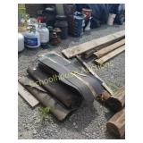 Pile shingles and roof paper. Great for shed