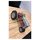 Old metal tractor toy no name. Rubber tires