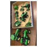 Flat of John Deere toys. Many are Ertl