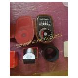 Exposure meter, e.leitz lens and lens case