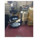 Black metal pedestal and 64 oz. Trump flask