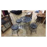 Tiny black iron set. With 4 chairs and little