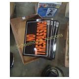 Flat of several no trespassing signs