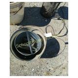 Bucket with aluminum flashing rolled up inside