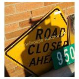 Road closed ahead sign