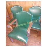 Three green vinyl  chairs with metal tacks and